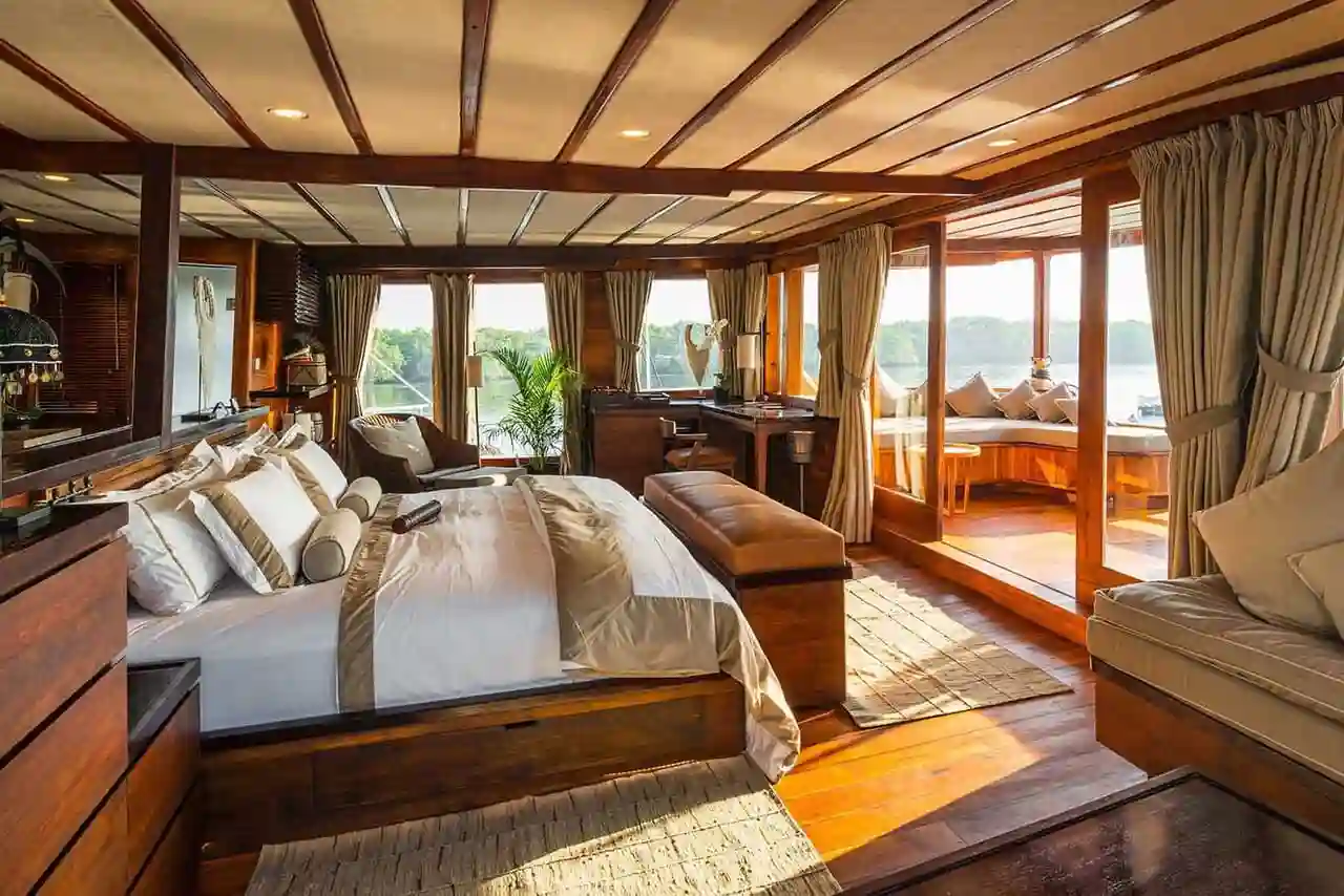 A teak-panelled cabin aboard a phinisi